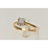 AN 18CT GOLD SINGLE STONE DIAMOND RING, round brilliant cut diamond illusion set in a white metal