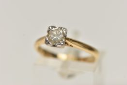 AN 18CT GOLD SINGLE STONE DIAMOND RING, round brilliant cut diamond illusion set in a white metal