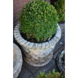 A LARGE COMPOSITE CYLINDRICAL TAPERED GARDEN PLANTER, with rope effect rims, and lattice style