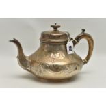 A VICTORIAN IRISH SILVER TEAPOT OF SQUAT PEAR SHAPE, domed cover with knop finial, foliate scroll