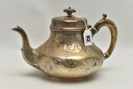 A VICTORIAN IRISH SILVER TEAPOT OF SQUAT PEAR SHAPE, domed cover with knop finial, foliate scroll