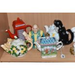 FIVE NOVELTY TEAPOTS, comprising a Sadler Championships 'A Round of Golf' teapot (some chipping