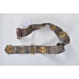 A LEATHER BELT WITH VARIOUS CAP BADGES AND SHOULDER TITLES ATTATCHED, there are twelves badges