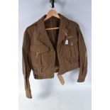 A 1949 PATTERN BATTLEDRESS BLOUSE WITH ESSEX HOME GUARD SHOULDER TITLES, this jacket is a size 6 and