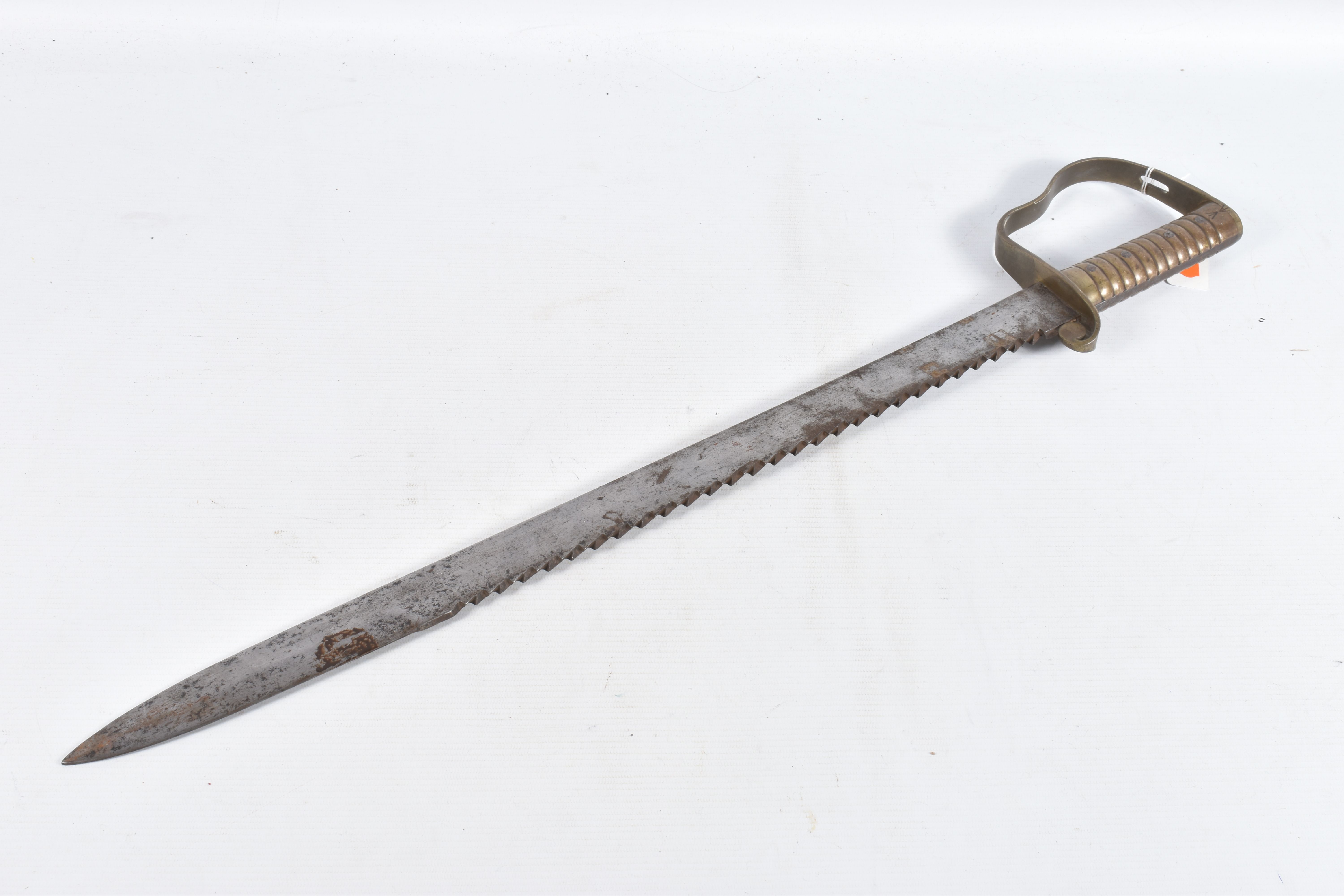 A BRITISH 19TH CENTURY WILKINSON PIONEERS SAW BACK SWORD ,one side of the blade features a broad