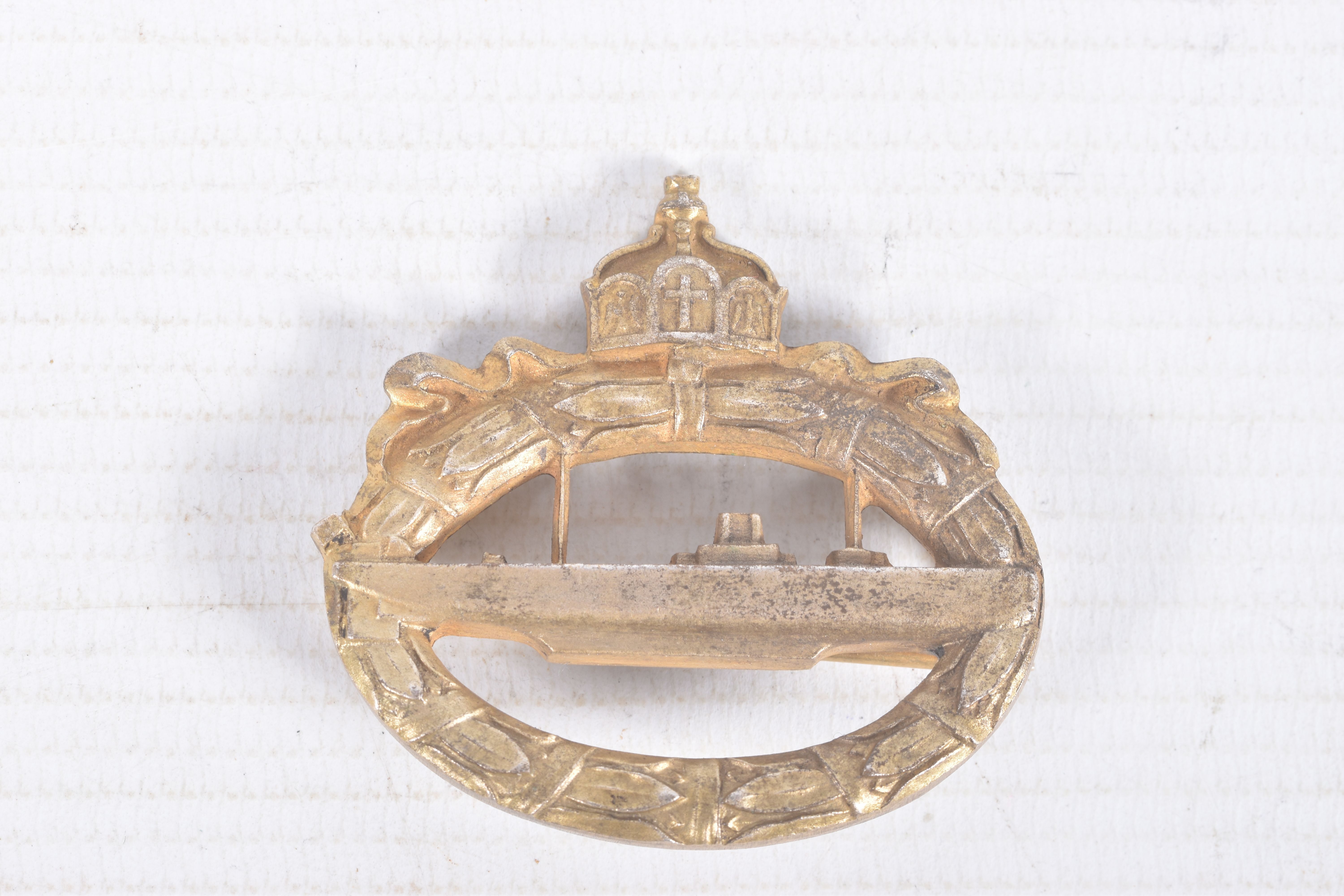 A WWI ERA IMPERIAL GERMANY U-BOAT BADGE, this is bronze in colour and has a pin fastener, it has