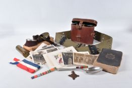 A SELECTION OF MILITARY ITEMS TO INCLUDE POSTARDS, bible, binoculars, goggles and ribbon bars,