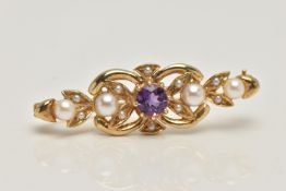 A 9CT GOLD AMETHYST AND SEED PEARL BROOCH, open work brooch set with a central circular cut