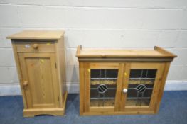 A PINE BEDSIDE CABINET, with a single drawer, along with a hanging lead glazed two door cabinet,