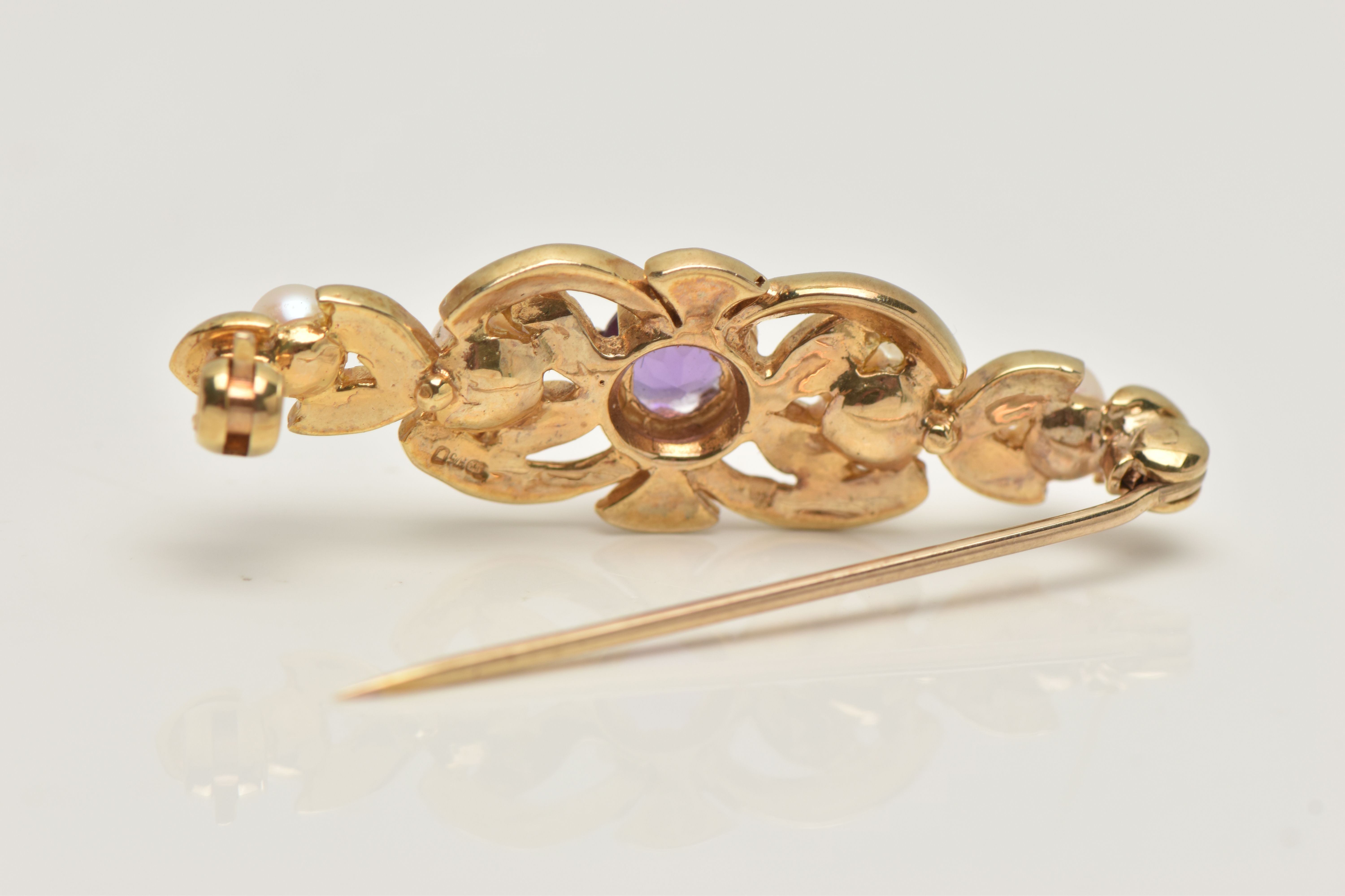 A 9CT GOLD AMETHYST AND SEED PEARL BROOCH, open work brooch set with a central circular cut - Image 4 of 4