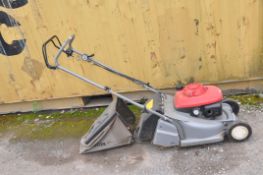 A HONDA HRB425C PETROL LAWN MOWER with grass bag (engine pulls freely but hasn't been started)