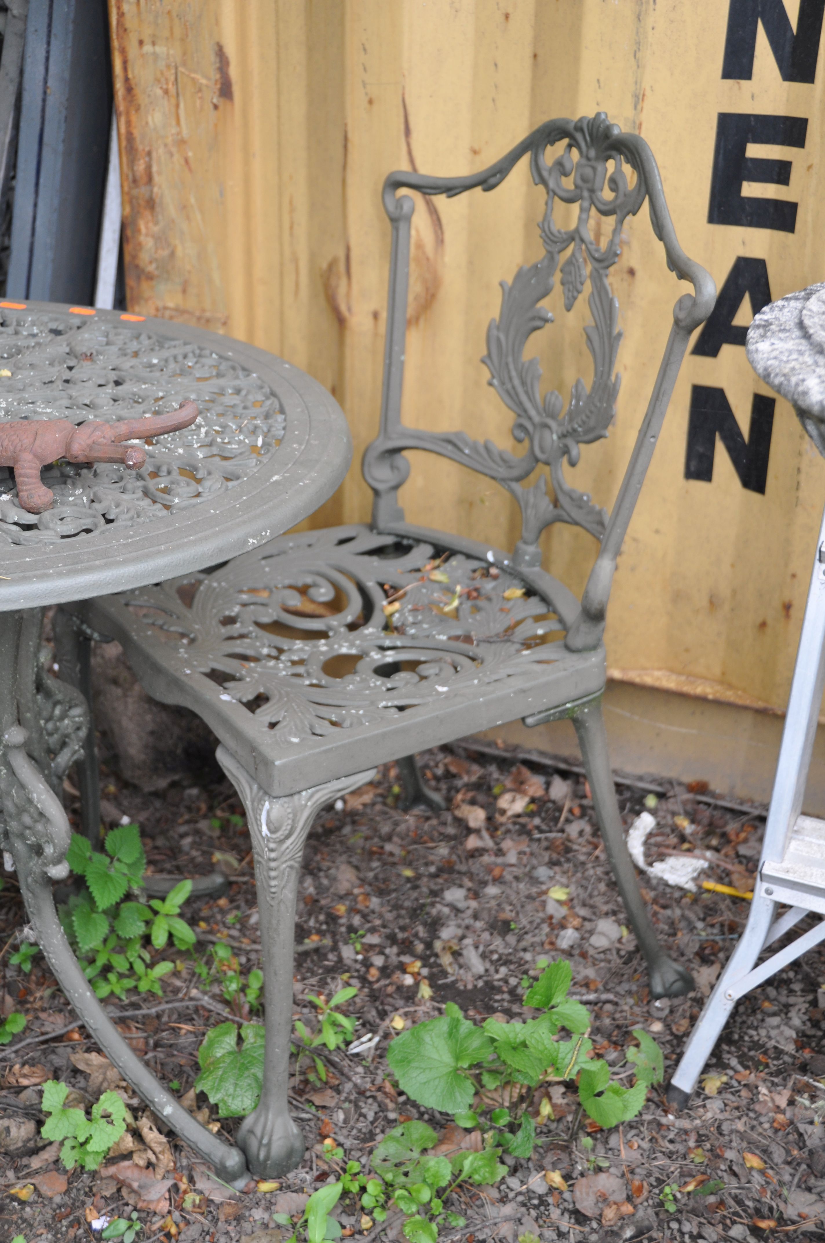 A MODERN CIRCULAR CAST ALUMINIUM GARDEN TABLE 69cm in diameter with two matching chairs, a Scarab - Image 4 of 5