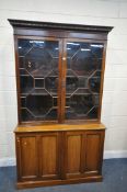 AN EARLY 20TH CENTURY MAHOGANY ASTRAGAL GLAZED TWO DOOR DISPLAY CABINET, above double panelled