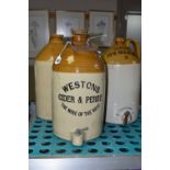 THREE STONEWARE FLAGONS, 'Westons Cider & Perry' with screw top and tap to side, 'Good its Masons'