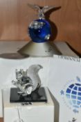 TWO BOXED SWAROVSKI CRYSTAL SCULPTURES, comprising a Crystal Planet designed to celebrate the year