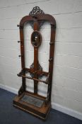 A VICTORIAN WALNUT AND OAK HALL STAND, with open fretwork detail, an arrangement of ten hooks,