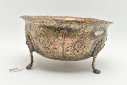 A LATE VICTORIAN SILVER BOWL, with wavy rim, repoussé decorated with foliate scrolls, birds and