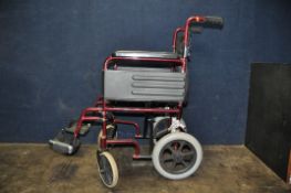 A Z-TEC FOLDING WHEELCHAIR with seat pad and two footrests (Condition some paint losses, tape to one