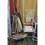 A PAIR OF ORNATE MODERN METAL FOLDING GARDEN CHAIRS and a selection of garden tools including