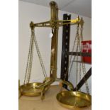 A SET OF W & T AVERY SHOP SCALES, of twin panned balance form, with mechanical lift, stamped