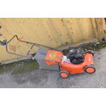 A FLYMO RL400PETROL LAWN MOWER with a Briggs and Stratton engine (pulls and starts)