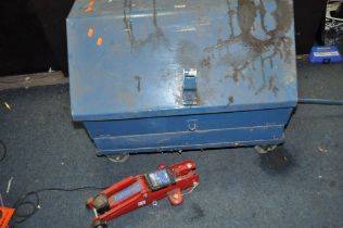 A MECHANICS ROLLING TOOLBOX containing tools including a vintage Torque wrench, spanners, mallets,