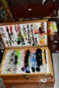 SIX WOODEN CASES OF 'FLY-TYING' MATERIALS, FLY FISHING HOOKS AND LURES, comprising a large