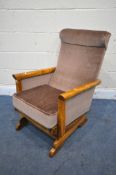 A STAINED ELM ROCKING CHAIR, with brown fabric (condition report: good)