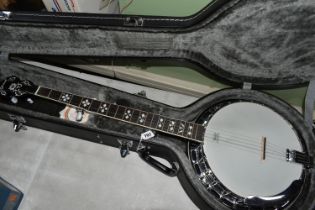 A CONTEMPORARY OZARK BANJO, with a Remo Weatherking banjo head, overall length 96cm, together with a