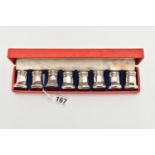 A CASED SET OF EIGHT CARTIER STERLING SILVER INDIVIDUAL SALT AND PEPPER POTS OF OCTAGONAL FORM,