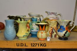 THIRTEEN CERAMIC JUGS AND VASES, to include 1930s hand painted jugs by Wadeheath, Burgess & Leigh,