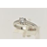 A SINGLE STONE DIAMOND PLATINUM RING, the brilliant cut diamond within a four claw setting to the