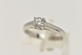 A SINGLE STONE DIAMOND PLATINUM RING, the brilliant cut diamond within a four claw setting to the