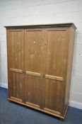 A PINE TRIPLE DOOR WARDROBE, width 149cm x depth 62cm x height 82cm, along with a pair of white