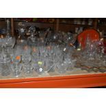 A QUANTITY OF GLASSWARE, comprising three decanters, a set of six cut glass wine glasses, a small
