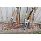 THREE BUNDLES OF GARDEN TOOLS including forks, rakes, hoes, spades, shears etc