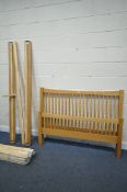 A MODERN OAK 4FT6 BEDSTEAD, with side rails and slats (condition report: missing one plastic slat