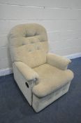 A BEIGE UPHOLSTERED MANUAL RECLINING ARMCHAIR (condition report: good)