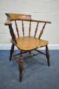 A 19TH CENTURY ELM AND BEECH SMOKERS CAPTAINS CHAIR