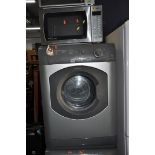 A HOTPOINT AQUARIUS TVM572 TUMBLE DRYER in silver (some rust to front panel) width 60cm x depth 60cm