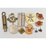 AN ASSORTMENT OF MILITARY ITEMS, to include pins and cap badges, a whistle also including a