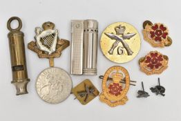 AN ASSORTMENT OF MILITARY ITEMS, to include pins and cap badges, a whistle also including a