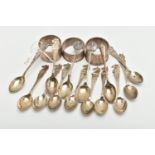 A PARCEL OF SILVER GOLFING TEASPOONS AND THREE ELIZABETH II CIRCULAR SILVER NAPKIN RINGS, the