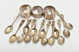 A PARCEL OF SILVER GOLFING TEASPOONS AND THREE ELIZABETH II CIRCULAR SILVER NAPKIN RINGS, the