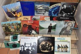 THREE THE BEATLES SINGLES AND EIGHTEEN LPS, TOGETHER WITH A 'FENDER' WALL MOUNT GUITAR HANGER, the