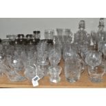 A LARGE QUANTITY OF CUT CRYSTAL AND GLASSWARE, comprising a Royal Doulton decanter (chipped