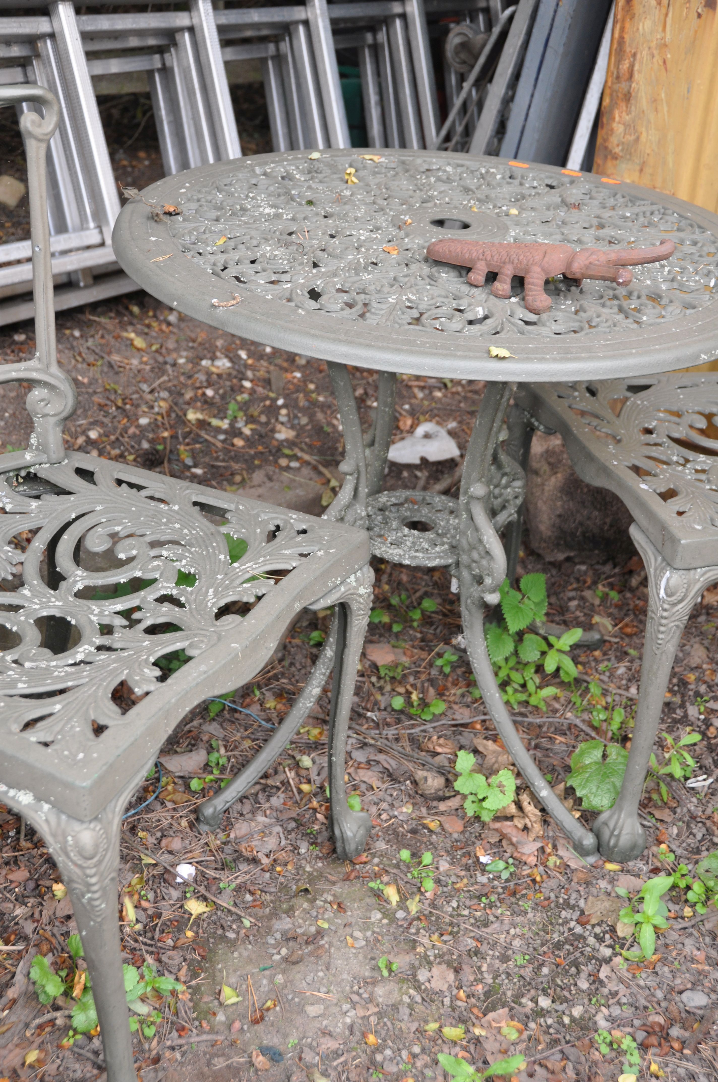 A MODERN CIRCULAR CAST ALUMINIUM GARDEN TABLE 69cm in diameter with two matching chairs, a Scarab - Image 5 of 5