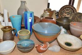 A LARGE COLLECTION OF STUDIO POTTERY, twenty nine pieces comprising large chargers, bowls, vases and