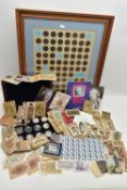 A CARDBOARD BOX CONTAINING COINS, BANKNOTES AND STAMPS, to include 8x Silver Proof Queen Elizabeth