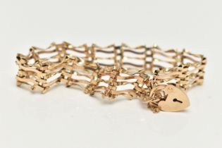 A 9CT GOLD GATE BRACELET, five bar gate bracelet fitted with a heart padlock clasp, with